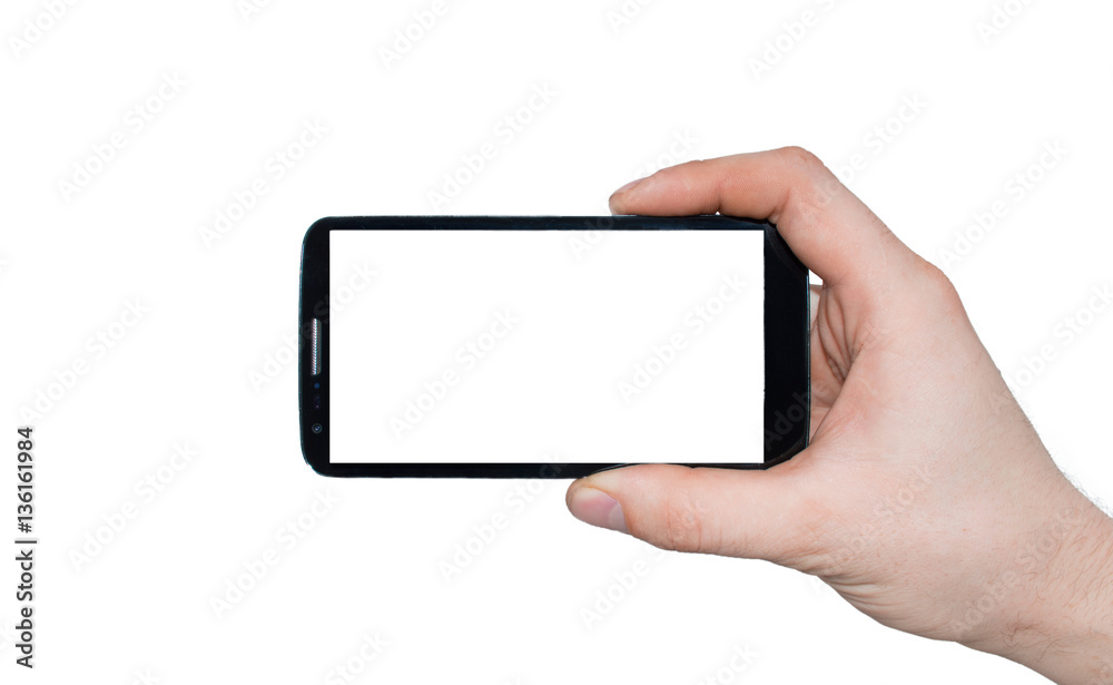 Wall mural A man  hand holding smart phone making photo isolated on white background