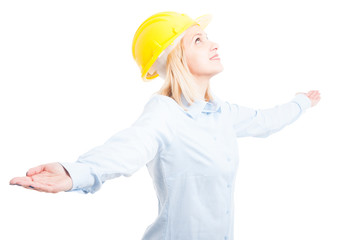 Portrait of female engineer posing looking happy