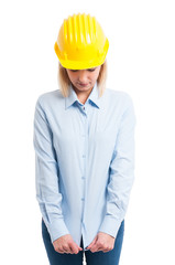 Portrait female engineer pulling her shirt down