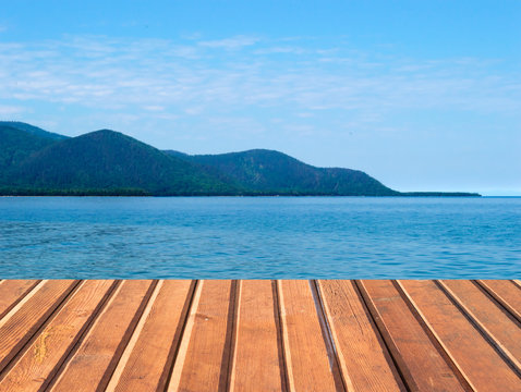 Empty wooden table island landscape © Aleksei