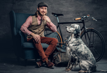 A man with dog and bicycle.