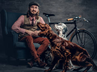 A man with dog and bicycle.