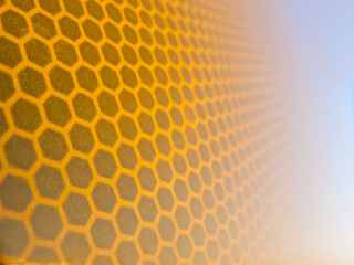 Honeycomb background texture from a reflective surface of a traffic sign