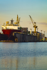 Fototapeta premium merchant ship in the shipyard for repairs in dry dock