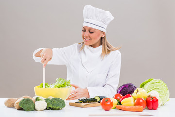 Female chef making healthy meal.