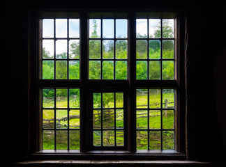 The wall and window of an old farmhouse inside