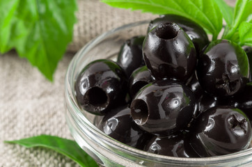 Detailed macro view of the black olives, pitted marinated