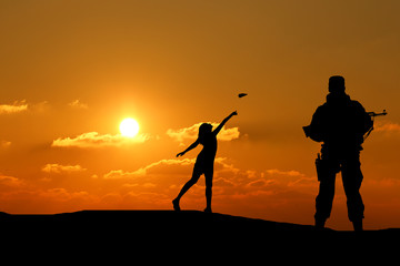 silhouette of a man with a gun and a little girl playing with a paper airplane