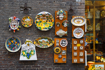 Traditional Italian souvenirs and artistic ceramics on the streets of Siena 