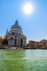 Grand Canal and Basilica Santa Maria della Salute on a sunny day in Venice, Italy