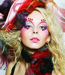 Beautiful woman with artistic make-up. 