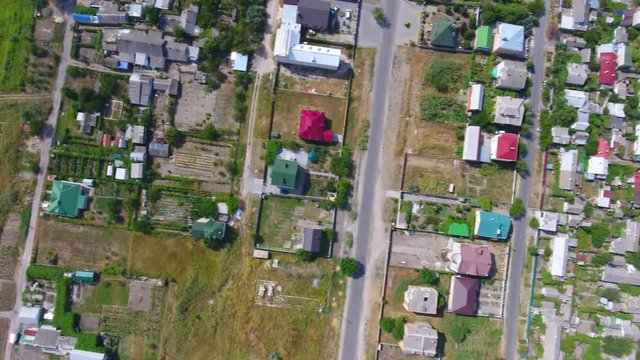 Aerial view of the road and houses in the Berdyansk city, Ukraine. 4K, Ultra HD video.