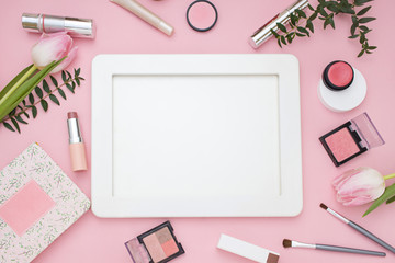 Cosmetic pink frame with flowers. Top view. Flat Lay