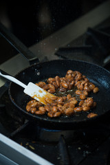 Preparing almond caramel on restaraunt kitchen