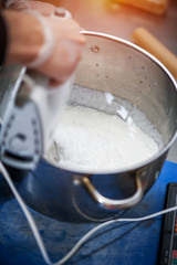 Preparing cream for dessert using mixer