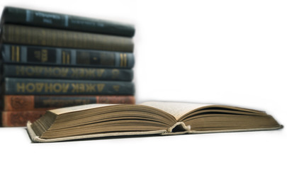 open book on background stack of books
