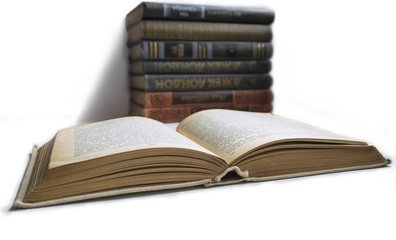 open book on background stack of books