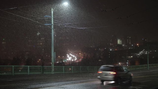 Snow Falling at Night in Seattle, Washington with City and Interstate 5 in the Background