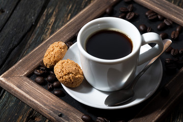 cup of black coffee on a tray