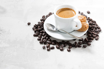 cup of fresh espresso and cookies on and white background
