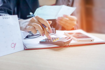 business woman calculating her monthly bills