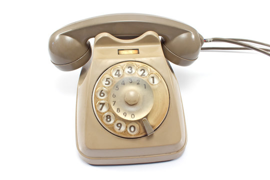 Old telephone isolated on white