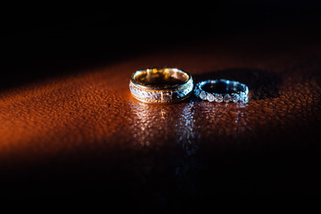 Wedding rings with water droplets against