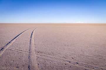 Car tracks on salt lake at Salar de Uyuni, Bolivia