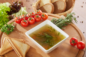 Bouillon soup with tomato