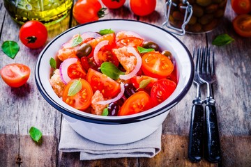 panzanella: Italian salad with tomatoes, ciabatta bread, olives, red onion and basil