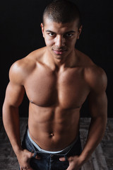 Fototapeta na wymiar Portrait of confident muscular african american young man