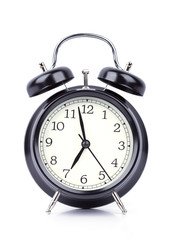 7 O' Clock on alarm clock isolated on white