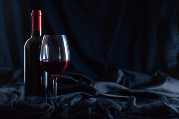  bottle and glass of red wine