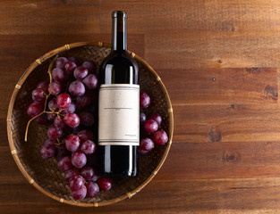  bottle of red wine with grape