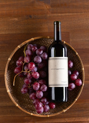  bottle of red wine with grape
