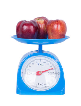 Apple On Kitchen Scale Isolated On White Background