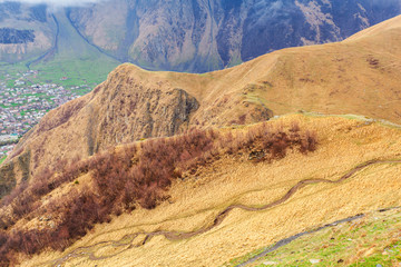 Mountain landscape near the village Stepantsminda Georgia in the early morning with fog. Spring season.