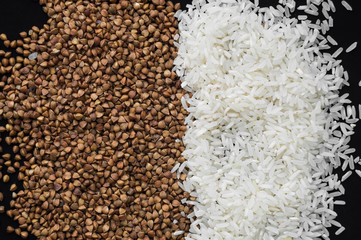 Rice and buckwheat on a wooden background