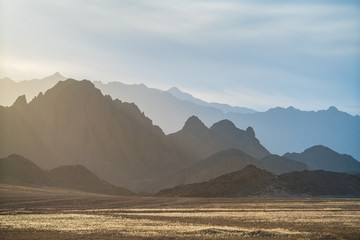 The sunny desert on the background mountain