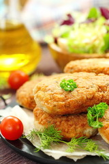 Chicken cutlets with vegetables and herbs