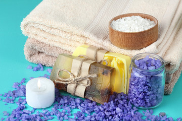 Obraz na płótnie Canvas Sea Salt and handmade soap on a blue background. Concept spa.