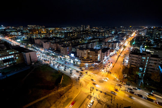Night view of the crossroad between Bill Clinton Boulevard and George W Bush Boulevard seen from the Mother Tereza Cathedral in Pristina, capital city of Kosovo.