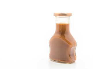 caramel bottle sauce on white