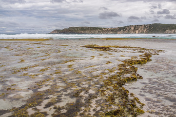 Pennington Bay at low tide in stormy weather landscape. Kangaroo Island, South Australia