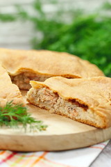 Pie with red fish and rice