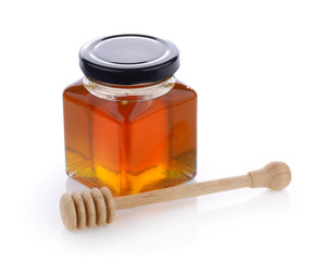 Honey with wooden honey dipper