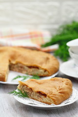 Pie with red fish and rice
