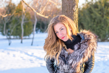 Girl in the park playing in the snow