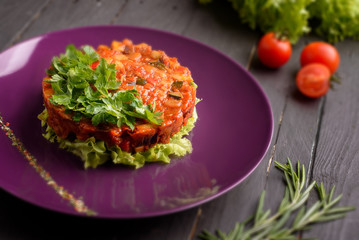 Carrot orange salad on purple plate