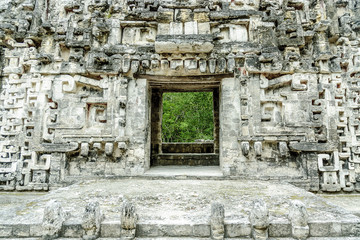 Fototapeta na wymiar sight of the front of the house of the mouth of the snake in the archaeological place of Chicanna, in the reservation of the biosphere of Calakmul, Campeche, Mexico.